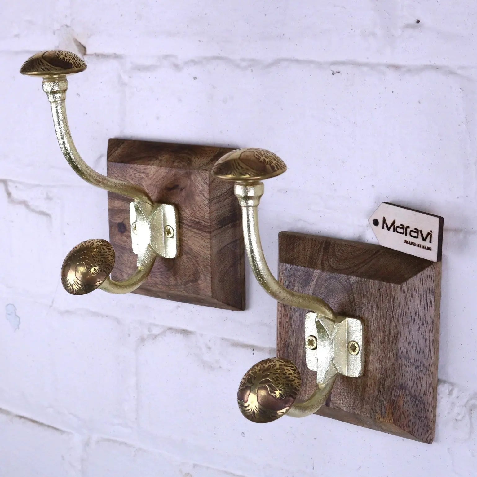 Brass gold coat hooks set of 2 with ornate antique gold mushroom-shaped tops mounted on dark wood plaques