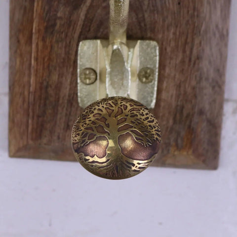Round brass-colored knob with intricate tree of life design for zerika antique gold coat hooks set of 2