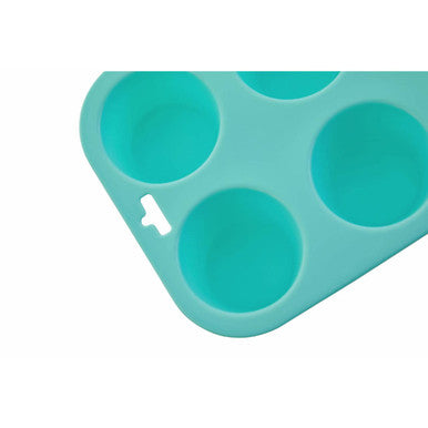 Pastel green silicone muffin mould with six rounded cups and small handle for easy baking and removal