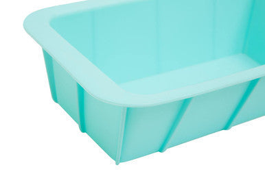Light blue silicone loaf mould with ribbed sides and rectangular shape perfect for baking bread