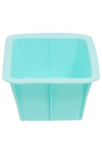 Pastel green silicone loaf mould with a square shape and smooth slightly raised edges for baking loaf bread