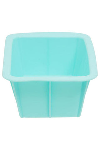 Pastel green silicone loaf mould with a square shape and smooth slightly raised edges for baking loaf bread