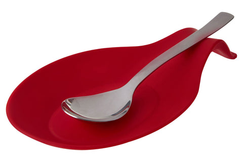 Zing red spoon rest with red silicone body holding a silver metal spoon for kitchen use