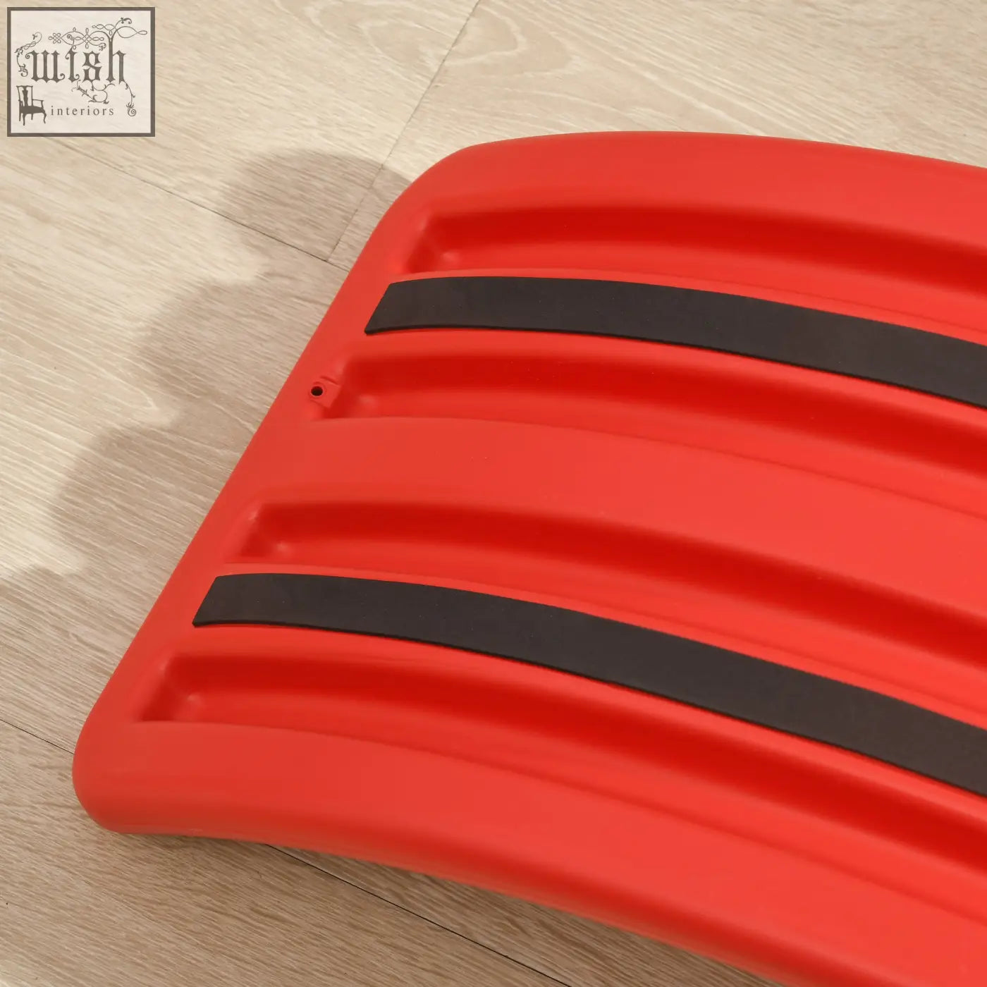 Red plastic zonekiz balance board with black rubber strips designed as a kids stepping stone toy for ages 3 to 6 years