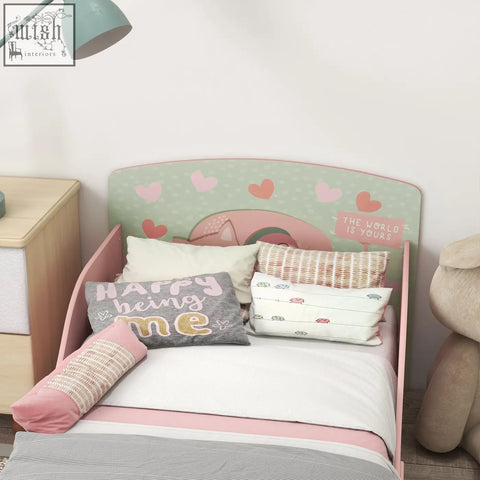 Pink wooden kids bed with mint green headboard and playful heart decals saying the world is yours by zonekiz