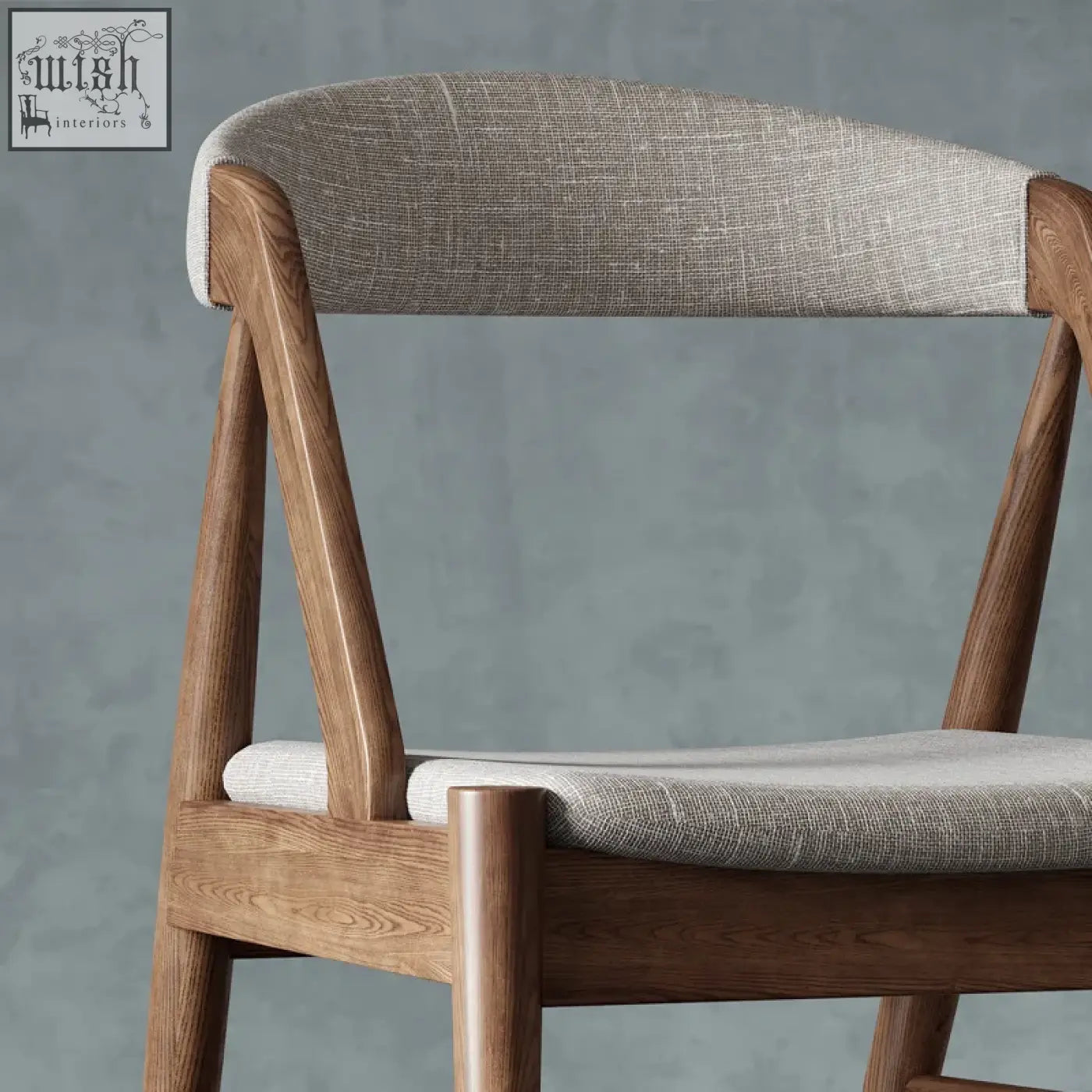 A zonka chair made of warm wood with light gray woven fabric seat and backrest in a minimalist design