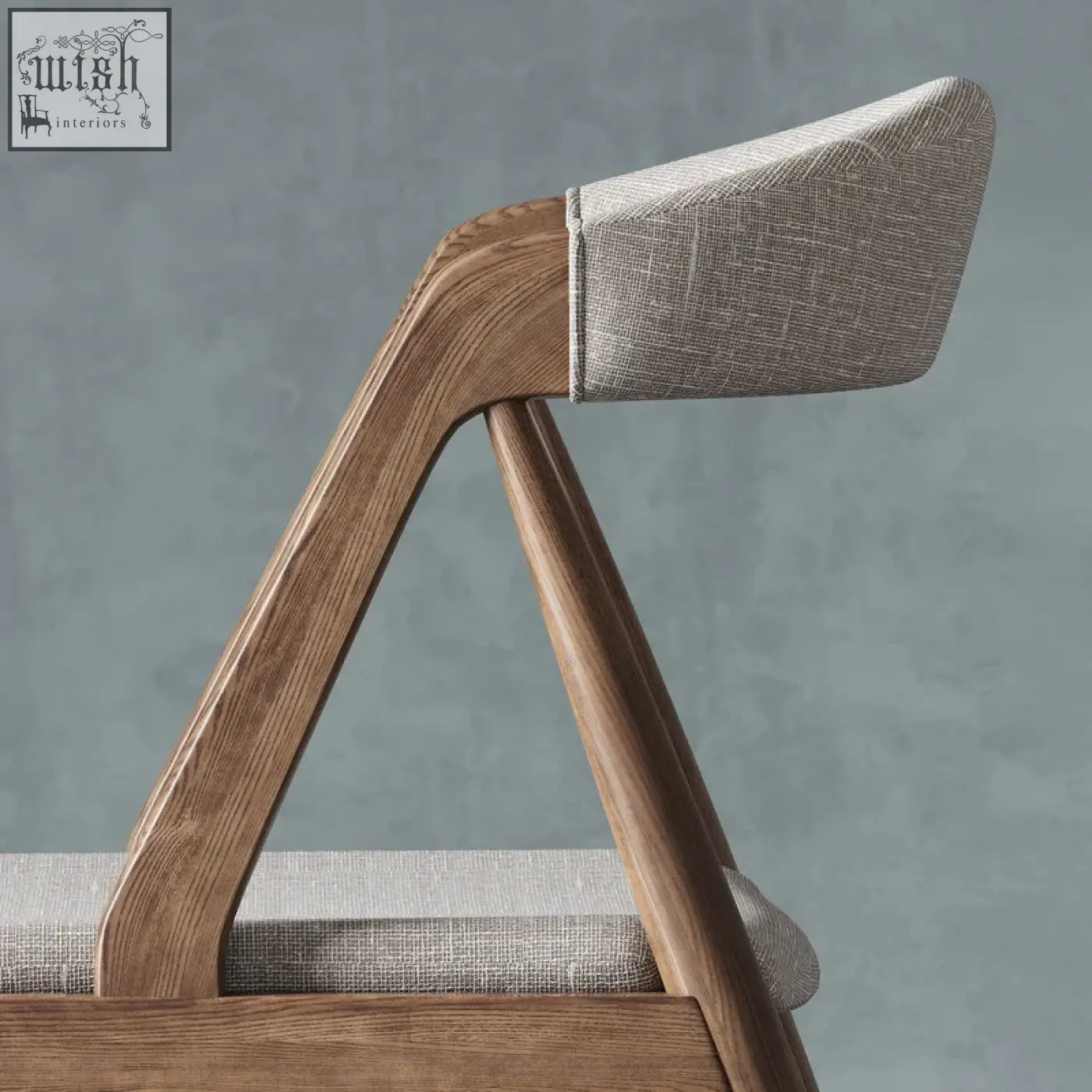 Modern wooden zonka chair with warm wood frame and light gray textured fabric upholstery on seat and backrest