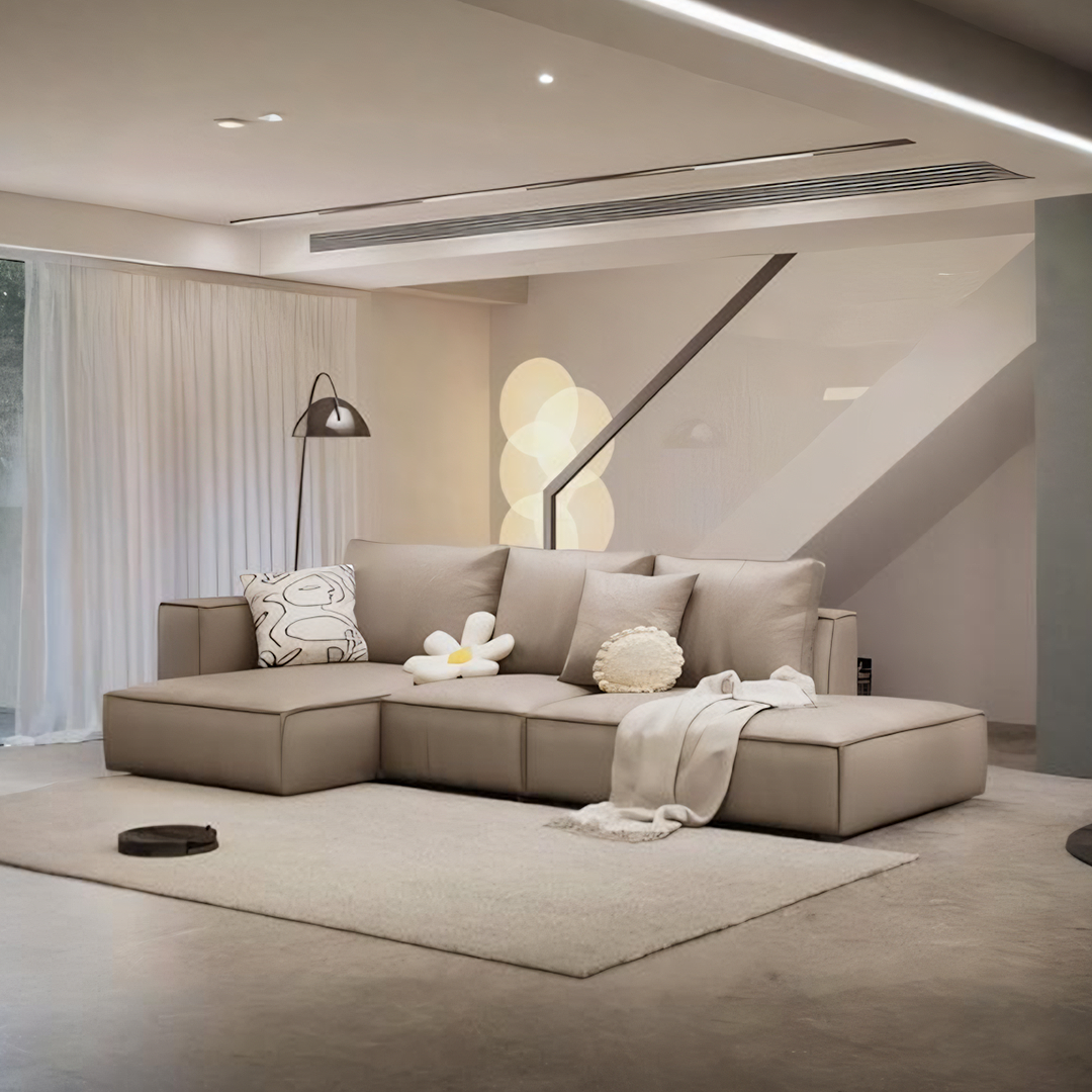 Beige zora four seater corner sofa with real leather upholstery and plush cushions in a modern design