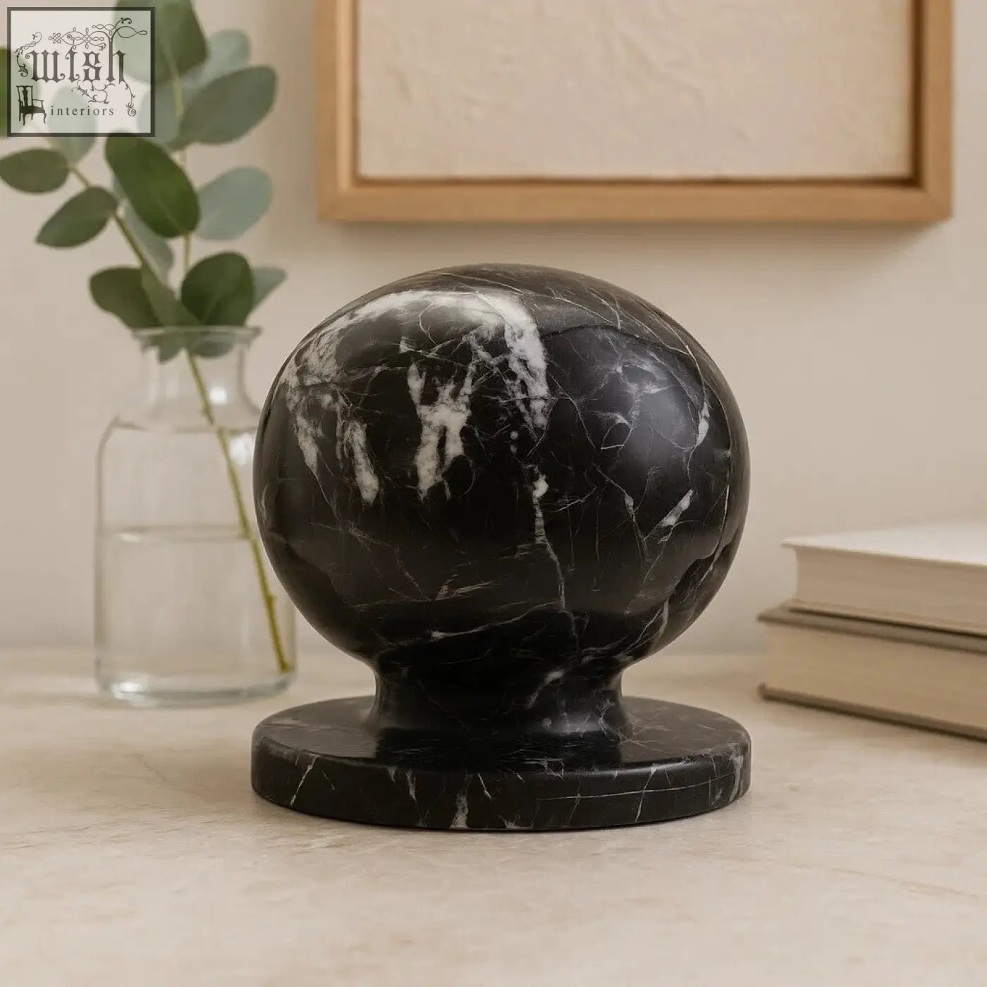 Zoro black and white veined marble ball sculpture with white veined black marble ball on a matching circular base