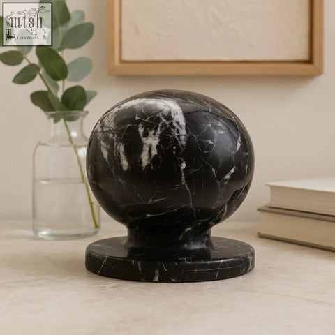 Zoro black and white veined marble ball sculpture with white veined black marble ball on a matching circular base
