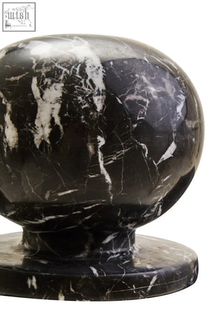 Zoro black and white veined marble ball sculpture featuring rounded black marble ball with white veining on a flat base