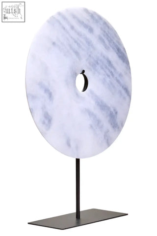 Zoro extra large round white marble disc sculpture with gray veining on a sleek black metal stand measuring 35cm
