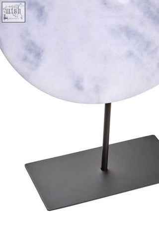 Zoro extra large white marble disc sculpture featuring an extra large round 35cm white marble slab on black stand