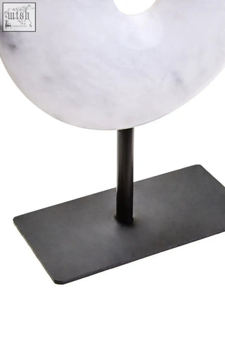 Zoro extra small white marble donut shaped disc sculpture on black metal stand with small round dia 15cm design