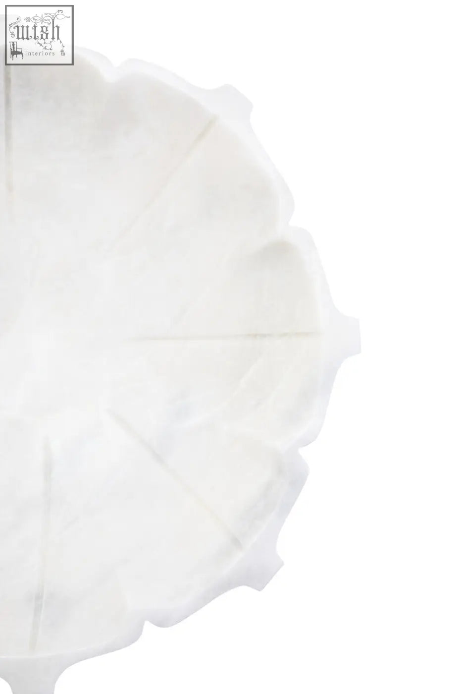 Zoro large white marble lotus bowl with a white scalloped-edge paper plate and subtle textured surface