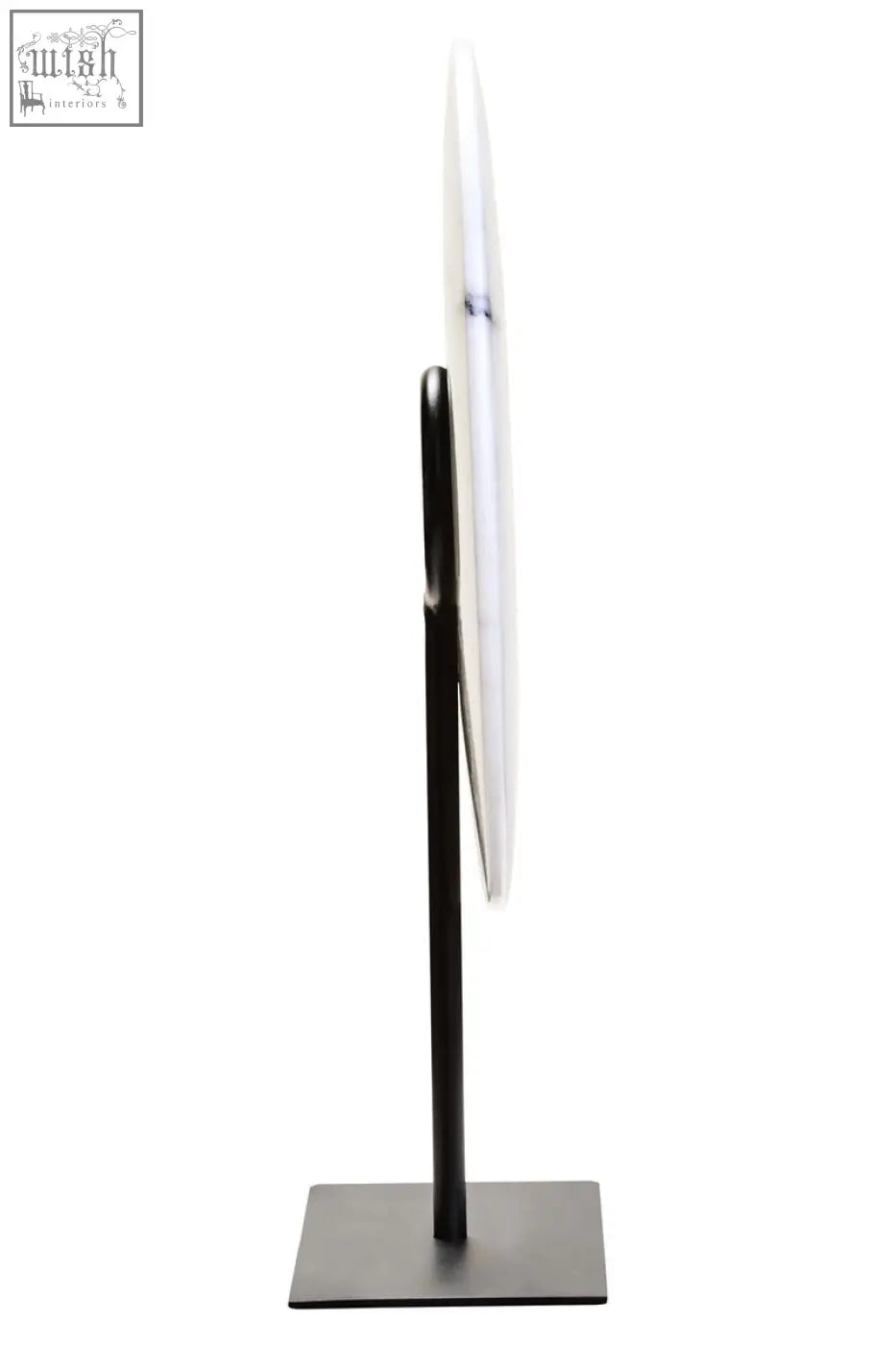 A sleek minimalist standing mirror with a black metal frame shown beside zoro medium round dia 25cm white marble disc sculpture