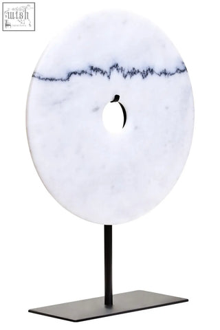 Zoro medium round white marble disc sculpture with black veining and central hole on black metal stand round dia 25cm