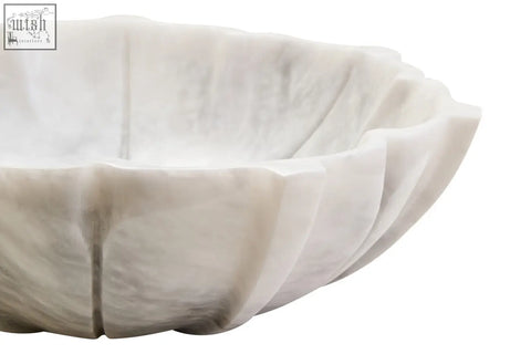 White marble lotus bowl with scalloped rim and subtle gray veining perfect for stylish serving or decor