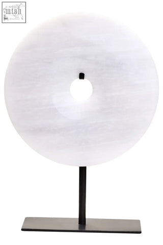 A sleek zoro small round table lamp with a white marble disc and minimalist black metal stand round dia 20cm