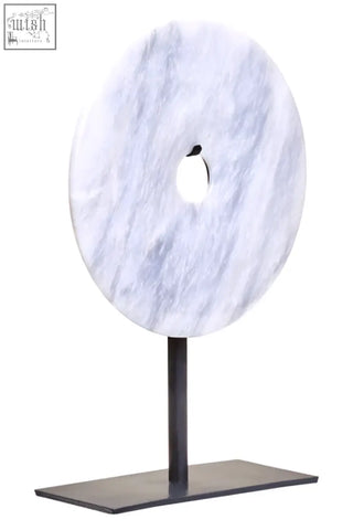 Zoro small round white marble disc sculpture with central hole mounted on sleek black metal stand round dia 20cm